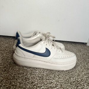 White Sneakers with Blue Swoosh